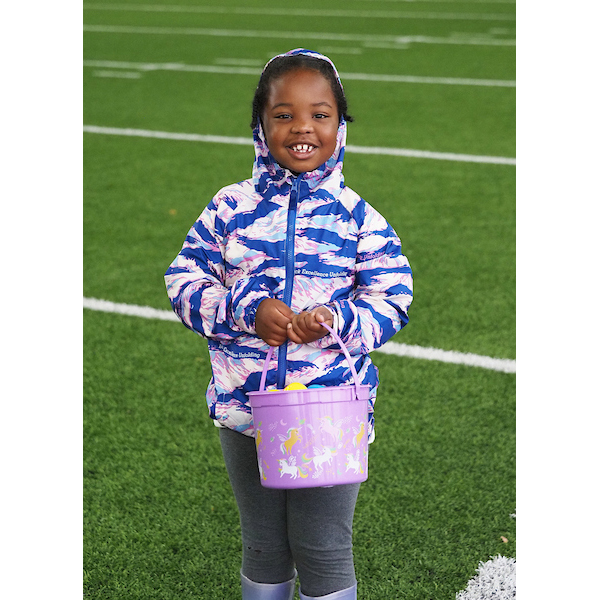 girl posing for the camera on the egg field