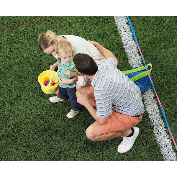 parents showing their child how eggs are collected