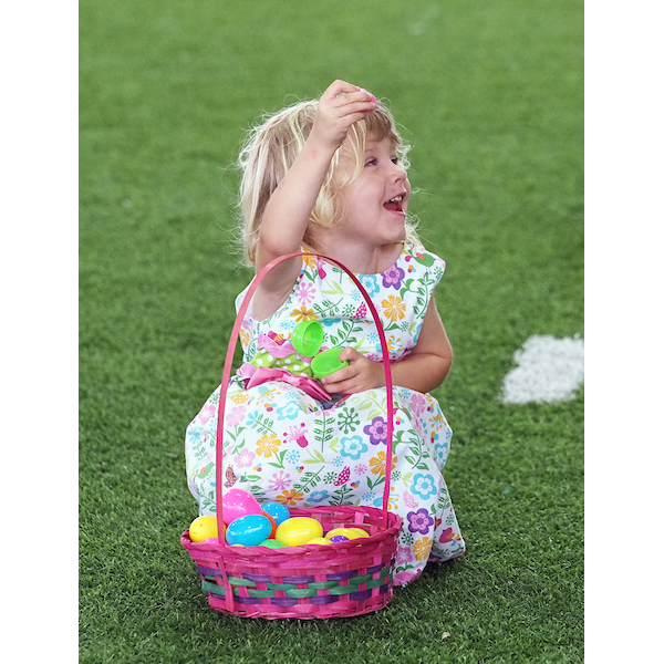 girl showing her family what she has found in an egg