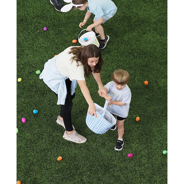 parent and child engaging in the egg hunt