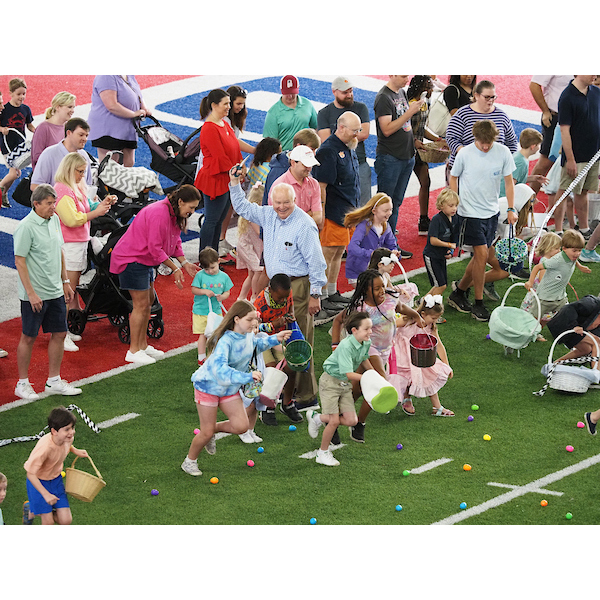 children racing each other for the Easter egg hunt