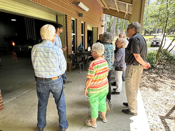 Glass blowing workshop shown from the outside, where the demonstration of the process is done