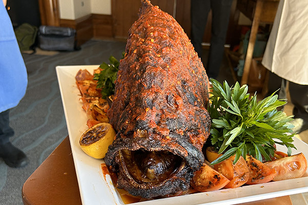 Fish being served at event.