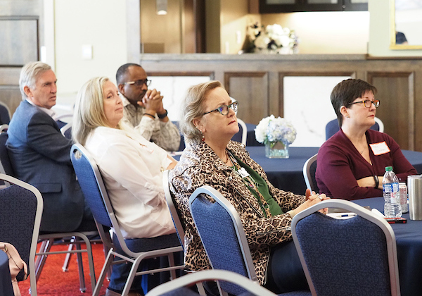 Attendees listening in on the presentation