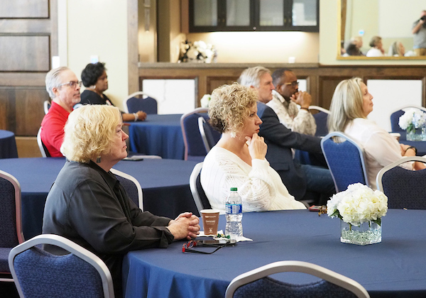 Attendees listening in on the presentation