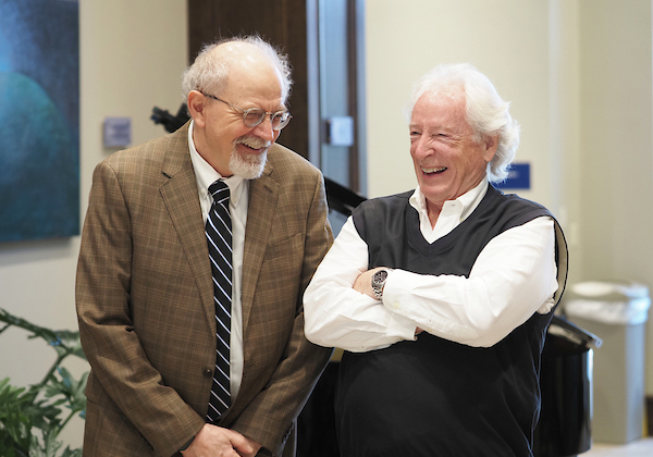 Richard Hayes laughing with a colleague