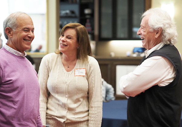 Richard Hayes speaking with colleagues