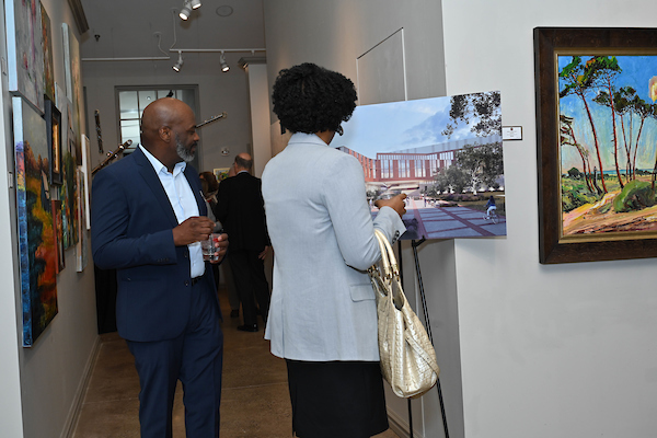 Alumni discussing the Frederick P. Whiddon College concept