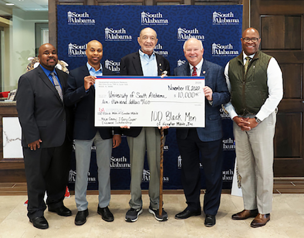 100 Black Men presenting check donation to USA's Dr. Mike Mitchell, Dr. Andre Greene, and President Bonner.