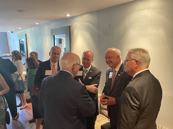 South Alabama President Jo Bonner having a conversation with South Alabama Alumni's.