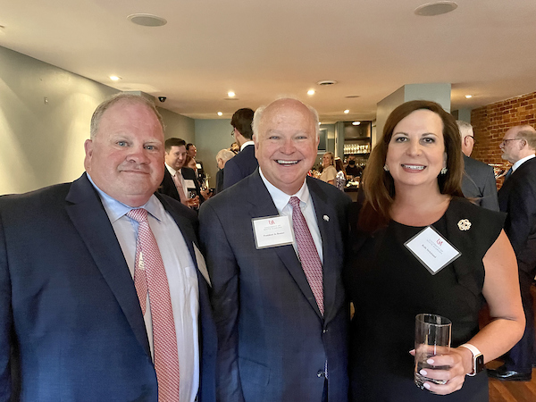 President Jo Bonner with South Alabama alumni's smiling for a picture.