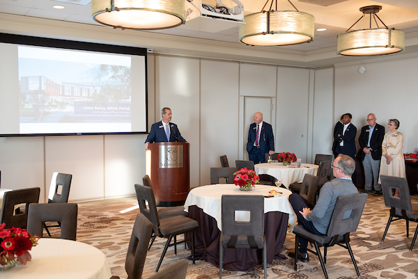 South Alabama Alumni speaking at the Alumni & Friends event.