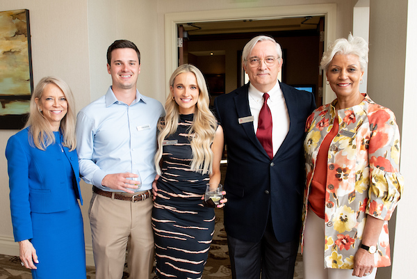 South Alabama Alumni posing for a picture at the event.