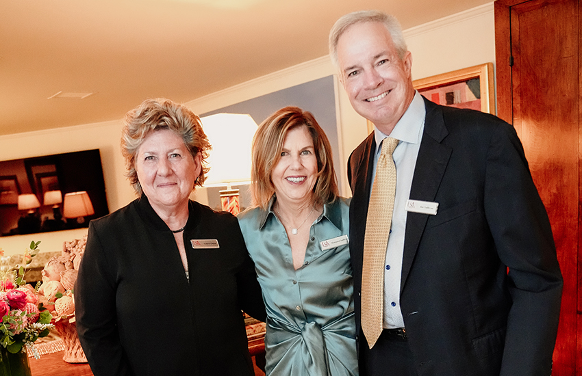 Margaret Sullivan with two alumni.