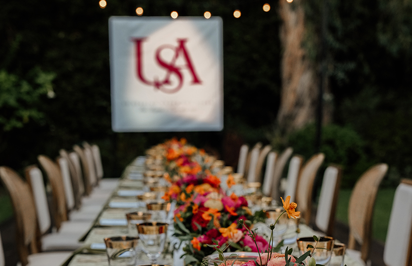 Table with USA logo in the background.