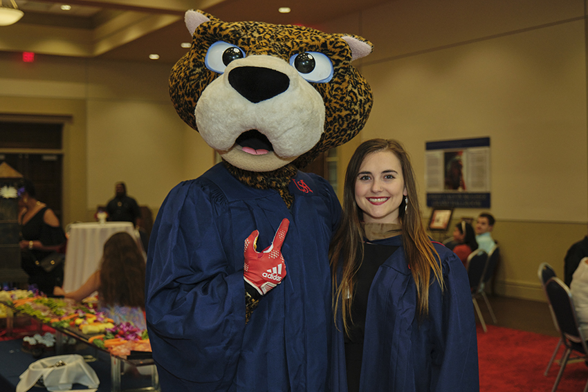 South Paw taking pictures with future graduates