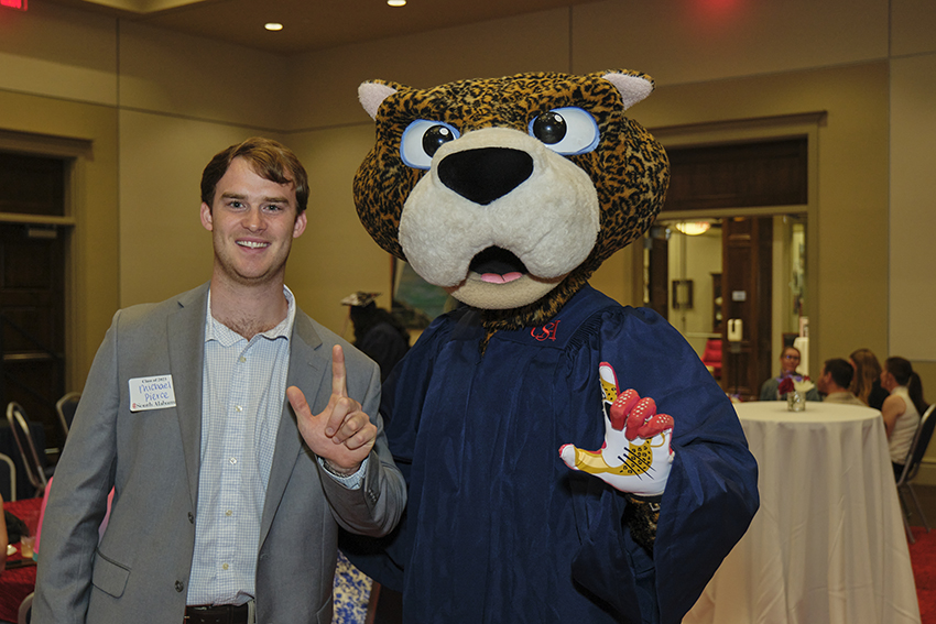 South Paw taking pictures with future graduates