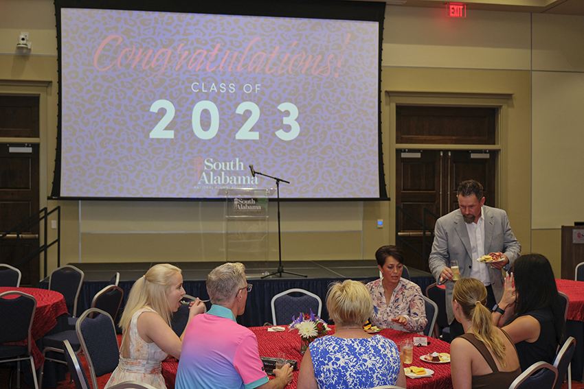 Attendees of the Champagne Toast Socializing