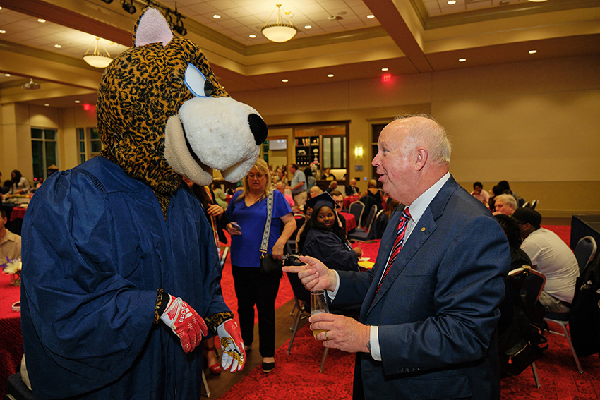 South Alabama President Jo Bonner socializing with South Paw