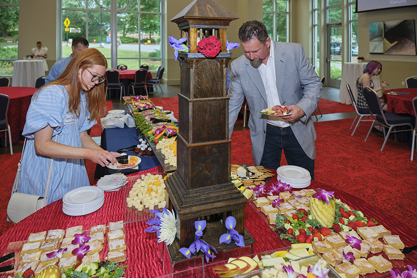 Attendees grabbing refreshments at the Champagne Toast