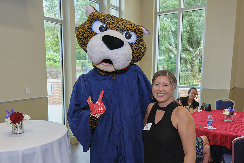 South Paw taking pictures with future graduates