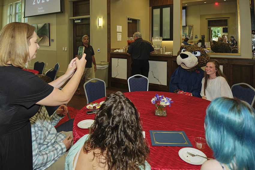 South Alabama Future Graduate posing for a picture with South Paw