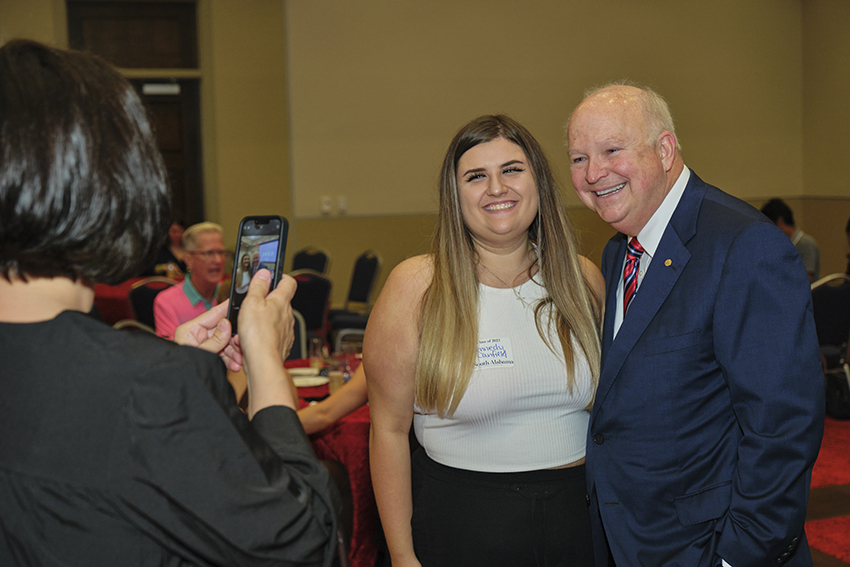 South Alabama President Jo Bonner taking a Picture with future South Alabama Alumni