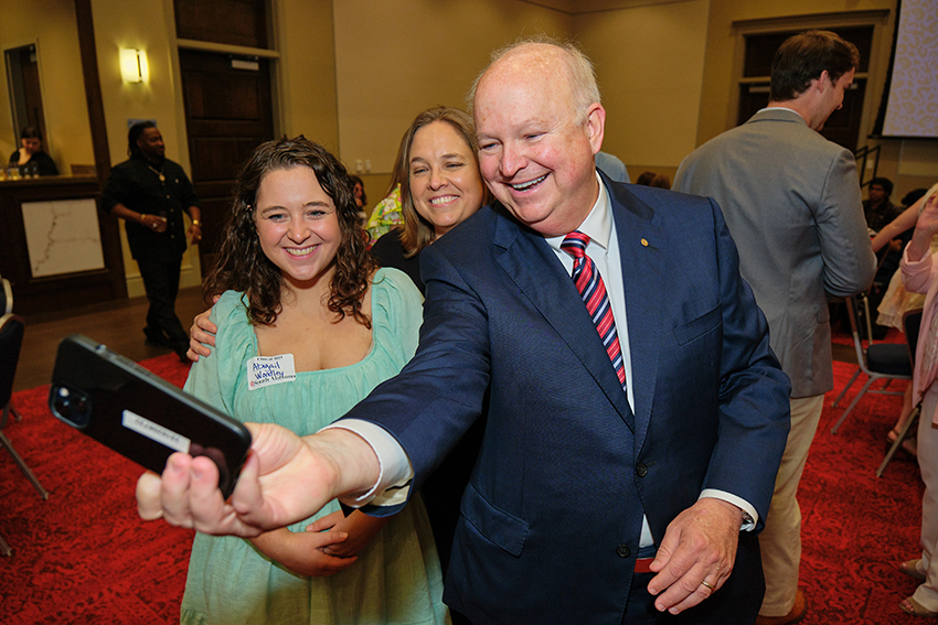 South Alabama President Jo Bonner taking a Picture with future South Alabama Alumni