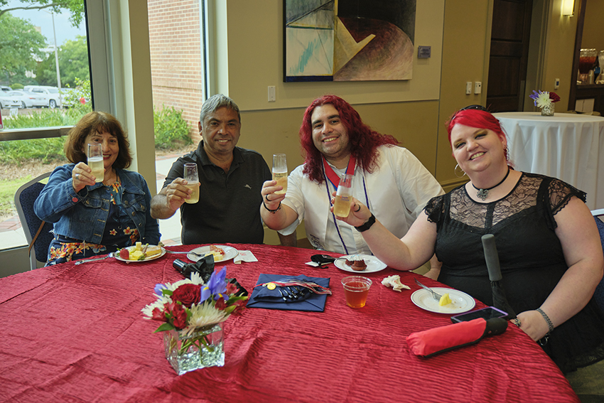 Attendees grabbing refreshments at the Champagne Toast