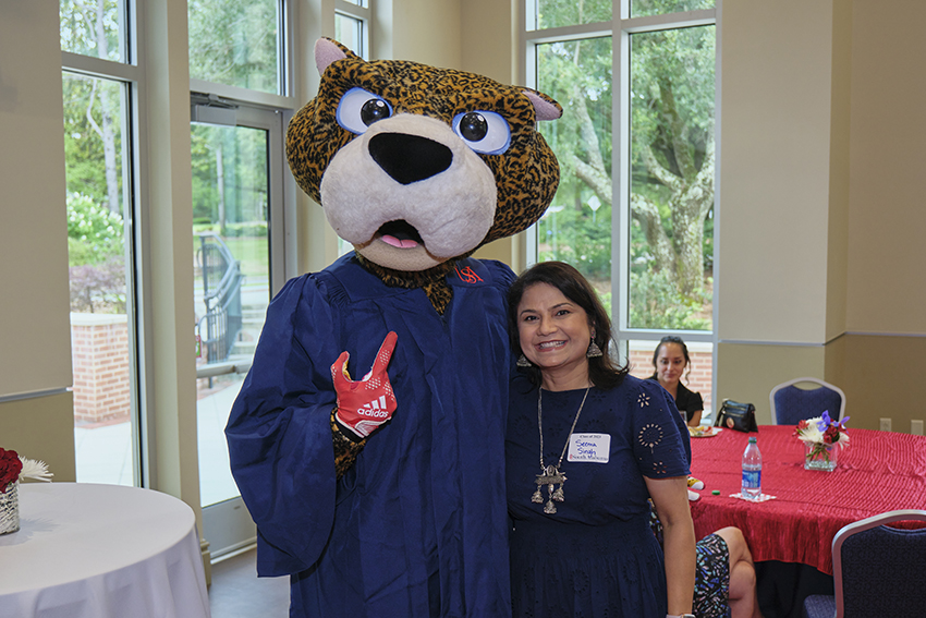 South Paw taking pictures with future graduates