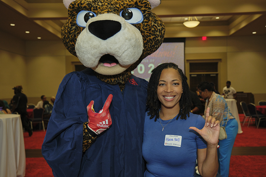 South Paw taking pictures with future graduates