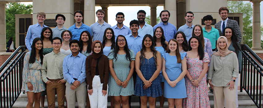 Mega Musical Chairs Officers group photo at Moulton Tower.