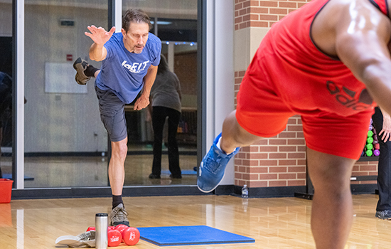 People in group exercise class.