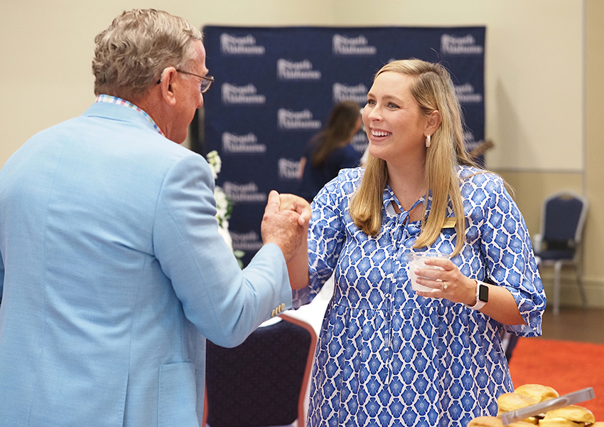 Two people shaking hands.