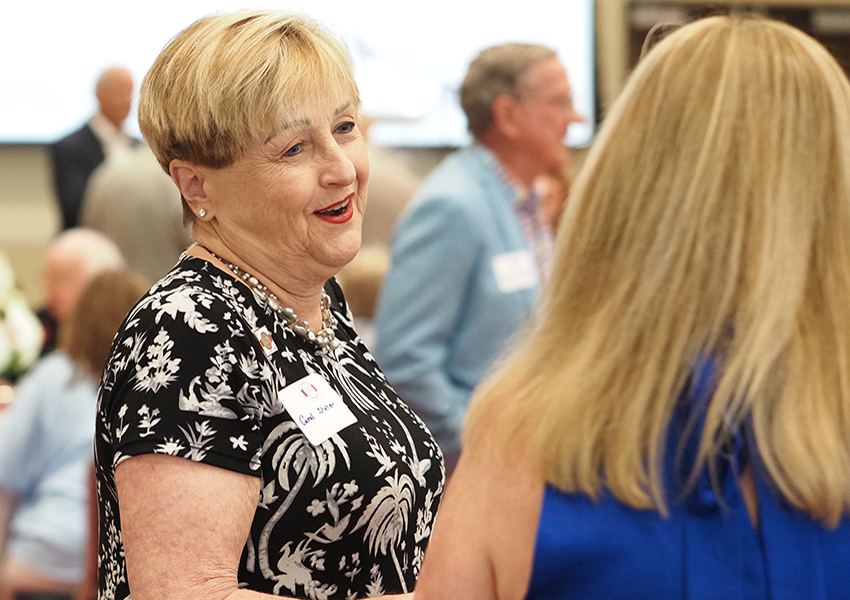 Woman smiling speaking with Karen Edwards.