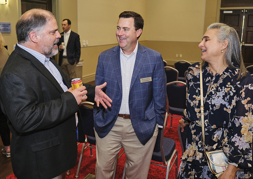 Three alumni talking.