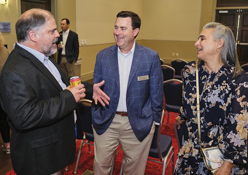 Three alumni talking.