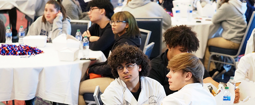 Crowd shot of students at conference.