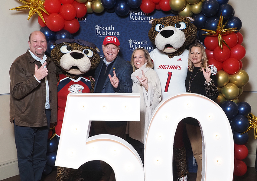 South Alabama's President Joe Bonner with his family and friends pose behind the "50" beside Ms. Paula and South Paw