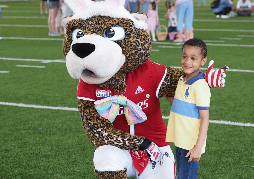 southpaw posing with a young boy