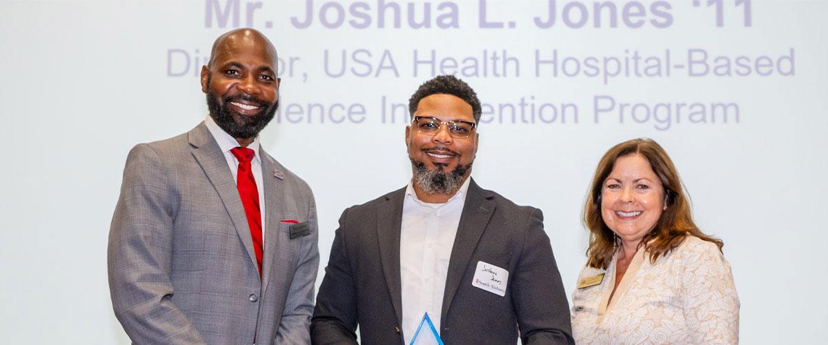 Joshua Jones with Alumni President and Karen Edwards