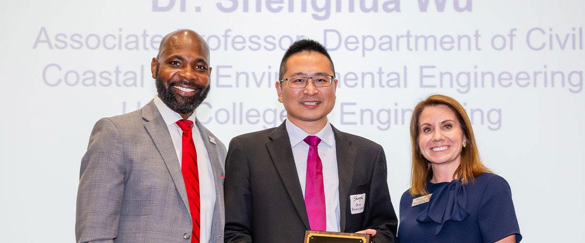 Dr. Wu with Alumni President and Kristin Odom