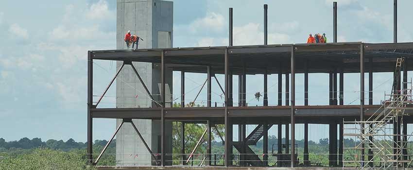 Constructions workers on scaffolding.
