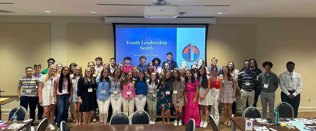 Student members taking a photo in the conference room for Student Leadership Class Session 1