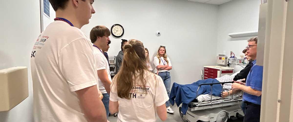 Students tour the Health Simulation building rooms