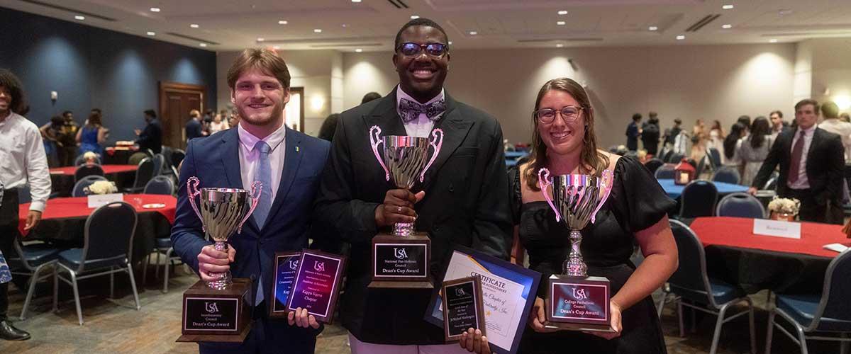 Students holding their awards.