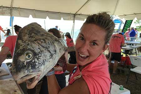 Molly Miller holding up a fish.