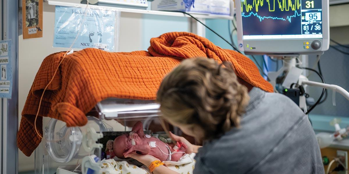PARENTS CREATE “CORNERS” and live within them: Families bring family photos and other items from home. In an open, sterile, often chaotic unit, it’s a necessary family comfort zone. Learning to eat independently is one of the toughest hurdles for some babies. Parents practice feeding routines here day after day as their child gains strength.