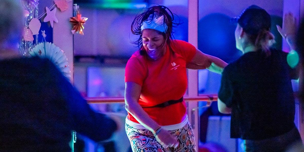Instructor leading Zumba in class.