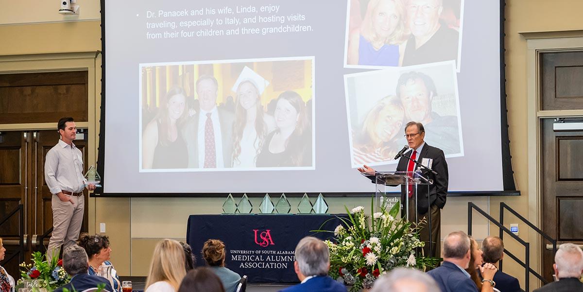 Medical Alumni Association meeting with a speaker 